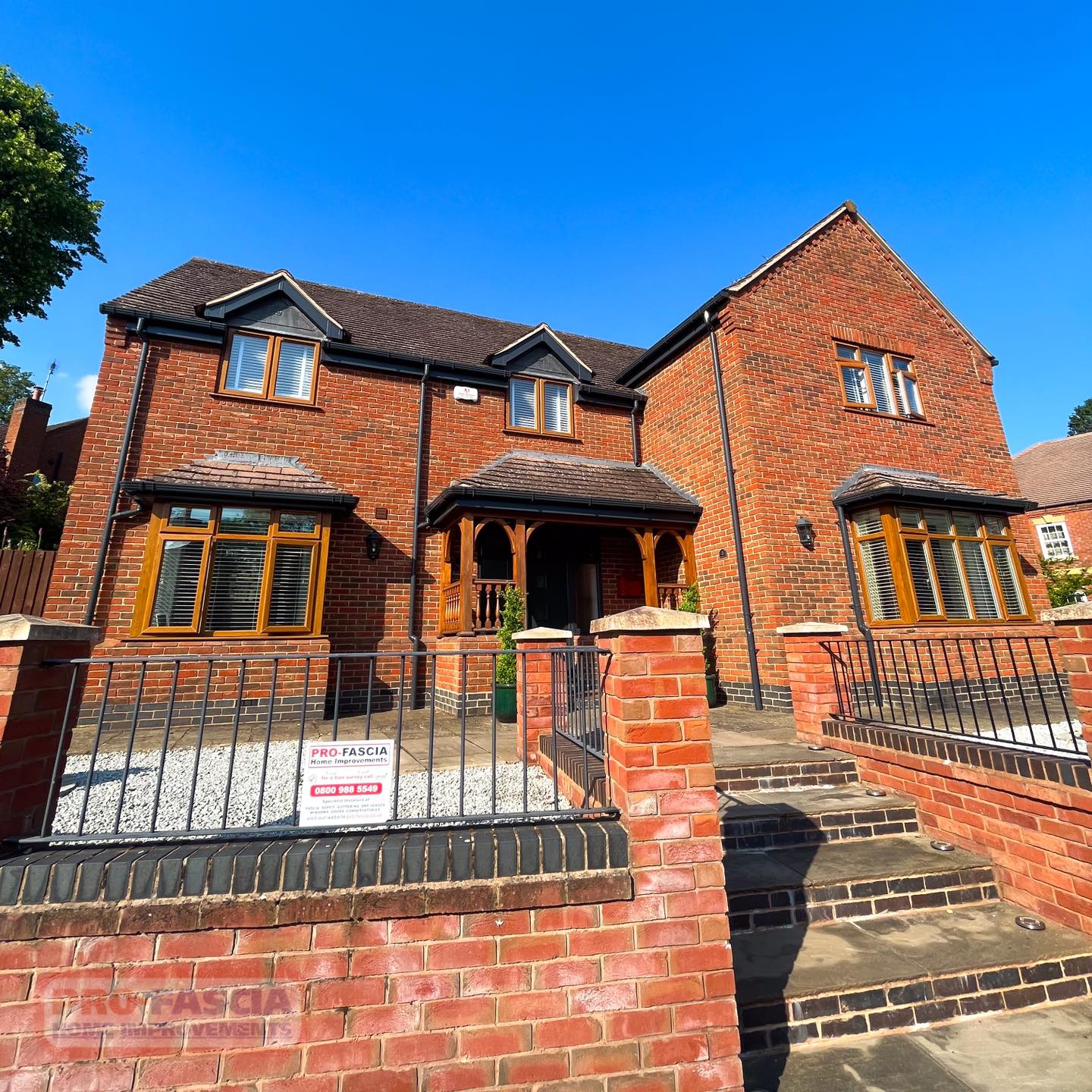 Pro-Fascia Home Improvements: Elegant Roofline and Entryway Upgrade in Redditch